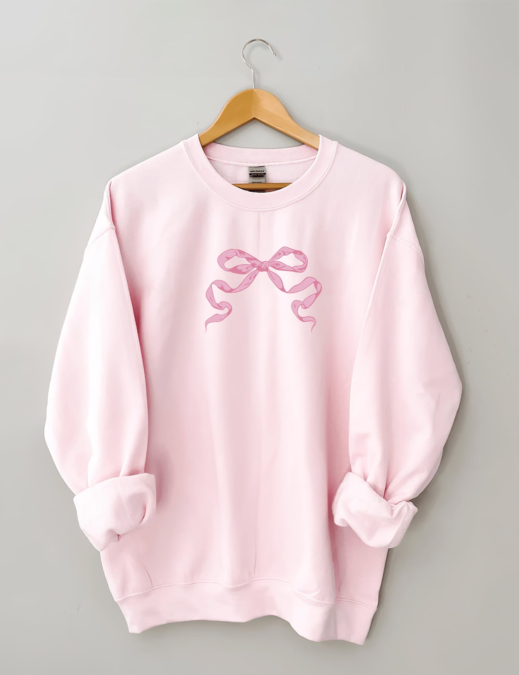 Sweat-shirt mignon avec nœud rose
